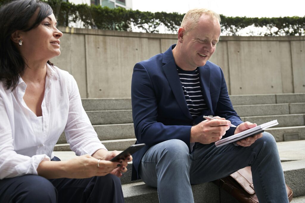 Two face-to-face marketing professionals learning from each other